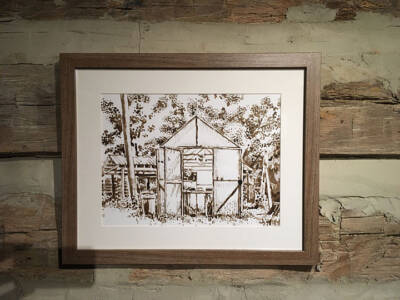 The greenhouse prim, inked, and framed on display.